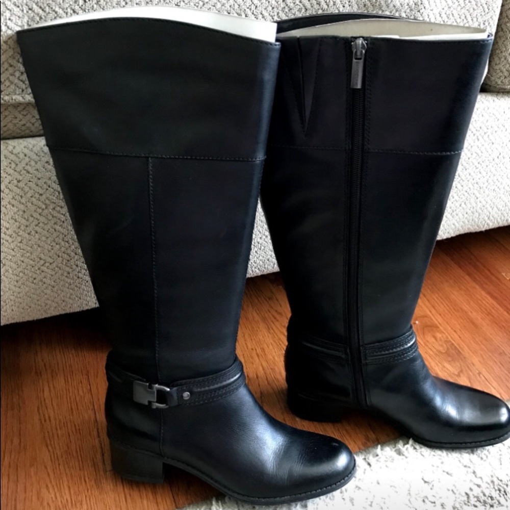 Black knee-high boots. Never worn!